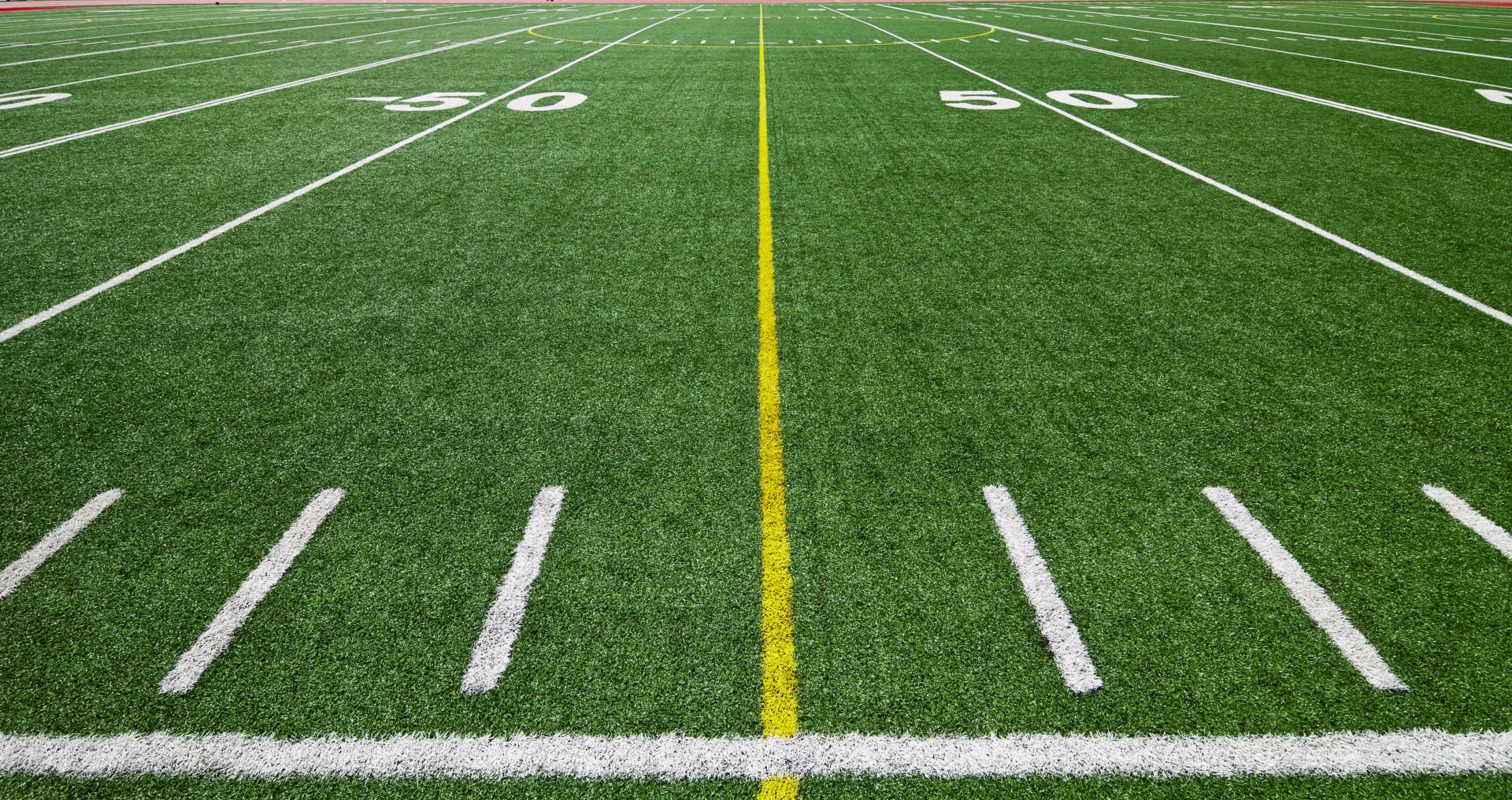 Football field showing numbers by 10, which end in IG in German and will be pronounced with a soft CH sound.