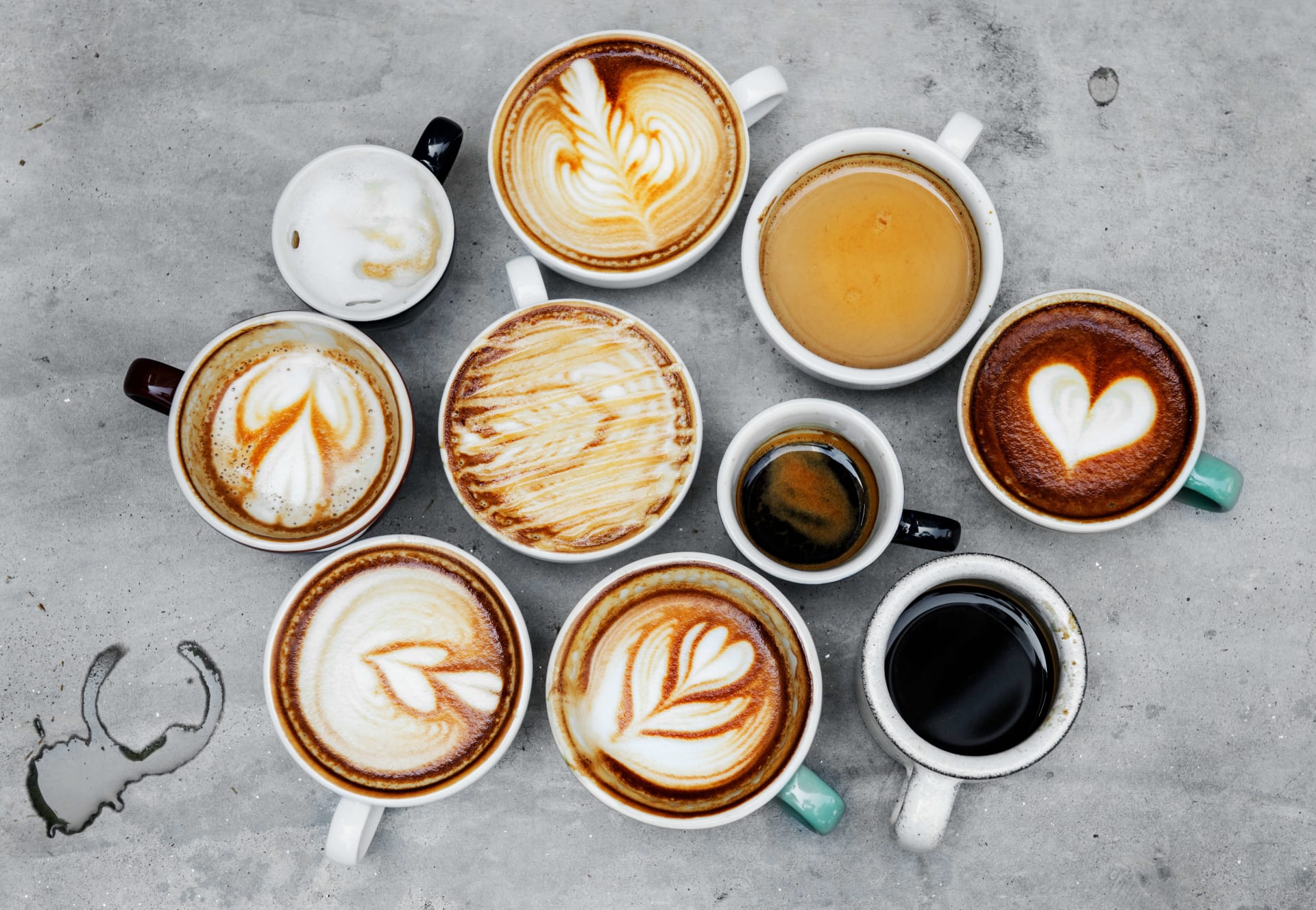Overhead view of various coffee drinks.