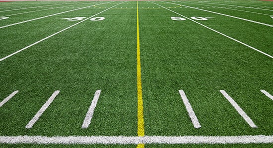 Football field showing numbers by 10, which end in IG in German and will be pronounced with a soft CH sound.